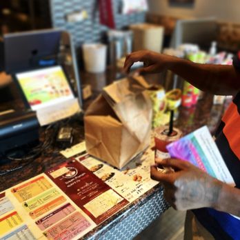 Kung Fu Tea - a person at a counter - Bubble Tea Near Me - Petersburg, Florida
