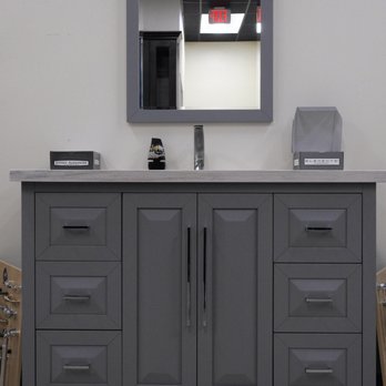 USA Cabinet Store - a bathroom vanity with a mirror - Kitchen & Bath Near Me - Conroe, Texas USA Cabinet Store - a bathroom vanity with a mirror - Kitchen & Bath Near Me - Conroe, Texas