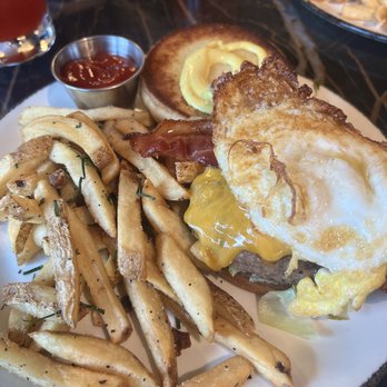 Curfew - Curfew Bacon Burger cheddar, lettuce, umami tomatoes, house pickles, toasted brioche bun, with egg - New American Near Me - Memphis, Tennessee