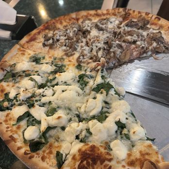 Ray's Pizza - Half  (white pizza with mozzarella, spinach and ricotta) second half  (sausage, tomato sauce, mushrooms, mozzarella and anchovies) - Pizza Near Me - Peoria, Arizona