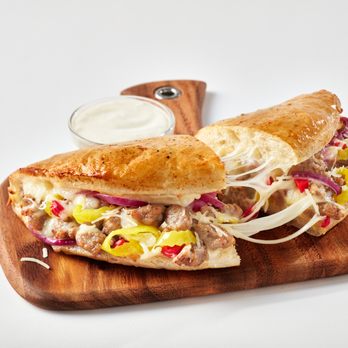 Schlotzsky's - a sub sandwich on a cutting board - Sandwiches Near Me - Mesquite, Texas Schlotzsky's - a sub sandwich on a cutting board - Sandwiches Near Me - Mesquite, Texas