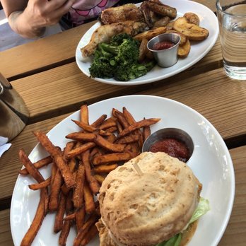 Sibling by Pushkin's - (Bottom) Crispy chicken sandwich with sweet potato fries (Top) Herbed half chicken - New American Near Me - Sacramento, California Sibling by Pushkin's - (Bottom) Crispy chicken sandwich with sweet potato fries (Top) Herbed half chicken - New American Near Me - Sacramento, California