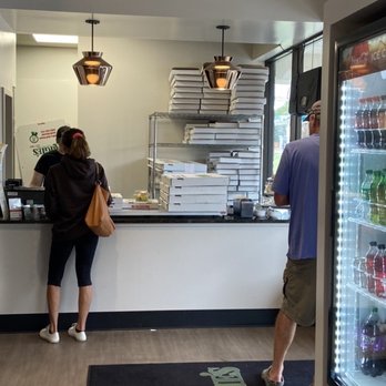 Augie's Pizza - Counter and pop cooler. Very busy on a Sunday. - Pizza Near Me - Chagrin Falls, Ohio