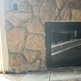 Grand Valley Flooring - Left damage to bottom of fireplace after removing old stone. - Flooring Near Me - Fraser, Colorado Grand Valley Flooring - Left damage to bottom of fireplace after removing old stone. - Flooring Near Me - Fraser, Colorado
