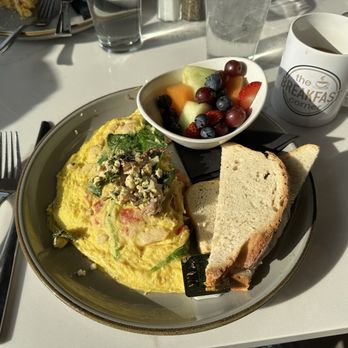The Breakfast Corner - Greek omelette (full egg) and fruit cup with sourdough bread toast - Breakfast & Brunch Near Me - St. Louis, Missouri The Breakfast Corner - Greek omelette (full egg) and fruit cup with sourdough bread toast - Breakfast & Brunch Near Me - St. Louis, Missouri