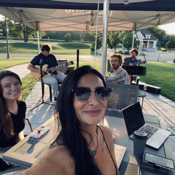 Niche - a group of people sitting at a picnic table - Wine Bars Near Me - Lake Geneva, Wisconsin