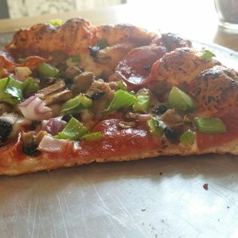 Aviator Pizza & Drafthouse - Bubbly pizza - Pizza Near Me - Austin, Texas