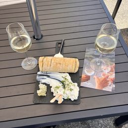 Whipped Ricotta and fresh honey with warm baguette. Accompanied by wine. Of course