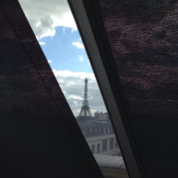 L'Oiseau Blanc - View of Eiffel through the blinds in the blazing sun of the afternoon. - French Near Me - Paris, 75