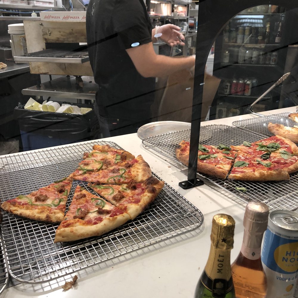 Andy’s Pizza - Tysons - A view of Margherita pizza and adult beverages. - Pizza Near Me - McLean, Virginia Andy’s Pizza - Tysons - A view of Margherita pizza and adult beverages. - Pizza Near Me - McLean, Virginia