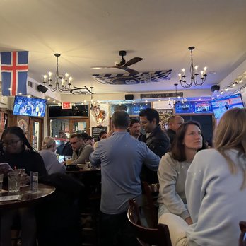 Valhalla - a group of people sitting at a bar - Pubs Near Me - New York, New York