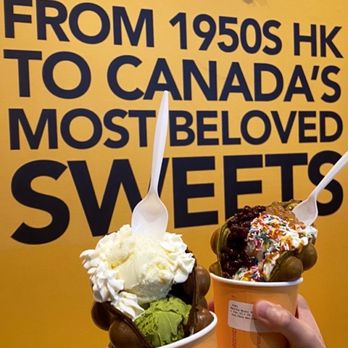 Golden Bubbles - two cups of ice cream in front of a sign that says from 1950 to canada's most beloved sweets - Waffles Near Me - Toronto, Ontario Golden Bubbles - two cups of ice cream in front of a sign that says from 1950 to canada's most beloved sweets - Waffles Near Me - Toronto, Ontario