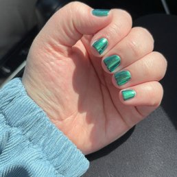 Black gel polish with green chrome.