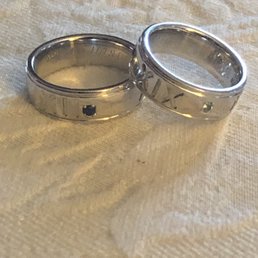 Our wedding bands now with birthstones representing our daughters mother and wedding date.