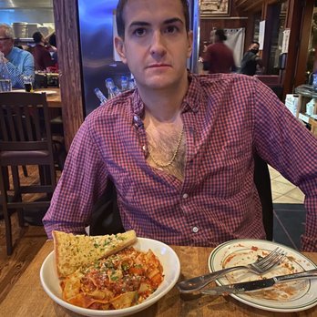 Enzo's Bistro and Bar - My husband with his pappardelle bolognese! - Italian Near Me - La Quinta, California Enzo's Bistro and Bar - My husband with his pappardelle bolognese! - Italian Near Me - La Quinta, California
