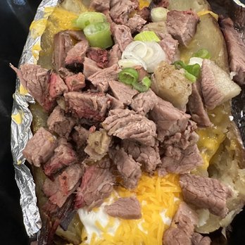 Ottos - Baked potato with brisket, served with bbq sauce - Barbeque Near Me - Houston, Texas Ottos - Baked potato with brisket, served with bbq sauce - Barbeque Near Me - Houston, Texas