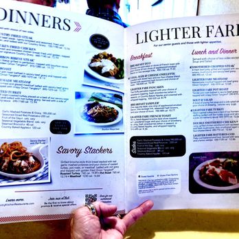 Country Kitchen - a person holding a menu in their hand - New American Near Me - Big Bear Lake, California Country Kitchen - a person holding a menu in their hand - New American Near Me - Big Bear Lake, California