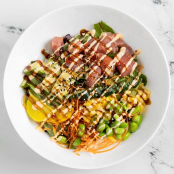 Shokutsuki - a bowl of food on a marble table - Asian Fusion Near Me - Montreal, Quebec Shokutsuki - a bowl of food on a marble table - Asian Fusion Near Me - Montreal, Quebec