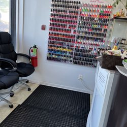 Pamper Nails - One of the polish walls at front desk