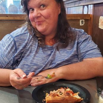 The Rail a Pizza Company - Happy customer with her dr.pepper and the dumpster pizza - Pizza Near Me - Rogers, Arkansas