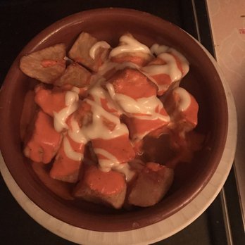 Bodega Spanish Tapas & Lounge - Patatas Bravas - delicious fried potatoes with spicy sauce and cheese. A must try on the menu! - Tapas Bars Near Me - Washington, DC, District of Columbia