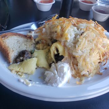 Joan's on Third - Remade hashbrowns atop an omelette to warm up the now cooled off omelette - Breakfast & Brunch Near Me - Los Angeles, California Joan's on Third - Remade hashbrowns atop an omelette to warm up the now cooled off omelette - Breakfast & Brunch Near Me - Los Angeles, California