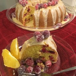 Whiskey Cakery Boise - Slice of Grand Marnier Cranberry Orange cake, with Grand Marnier icing, garnished with sugared cranberries