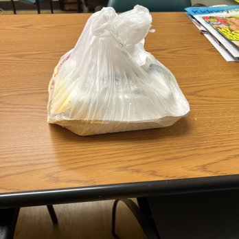 Little Mac Shack - a bag of food on a table - Food Delivery Services Near Me Little Mac Shack - a bag of food on a table - Food Delivery Services Near Me