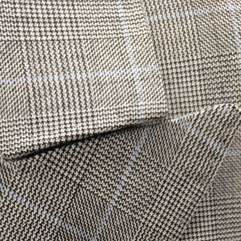 The Tailored Man - Detail of my double-breasted suit. Fabric is Holland & Sherry's 12 oz. worsted wool in Prince of Wales plaid with light blue windowpane. - Bespoke Clothing Near Me - McLean, Virginia