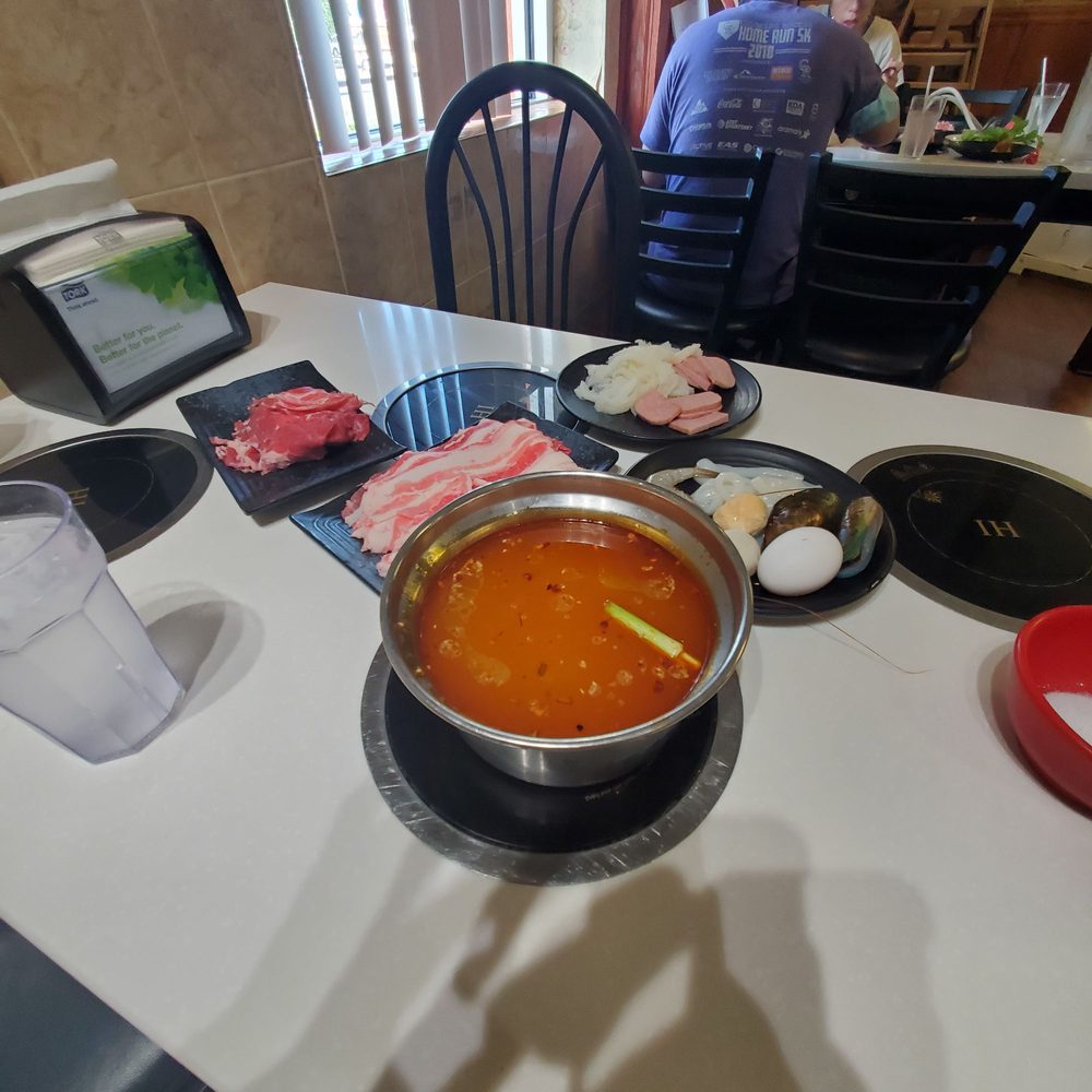 Yummy Hot Pot - Spicy bone broth, lamb, beef, tripe, luncheon meat, squid, shrimp, and an egg. - Hot Pot Near Me - Denver, Colorado Yummy Hot Pot - Spicy bone broth, lamb, beef, tripe, luncheon meat, squid, shrimp, and an egg. - Hot Pot Near Me - Denver, Colorado
