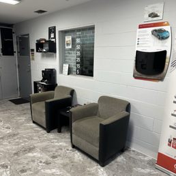 Waiting area with chairs, beverages, and tint options.