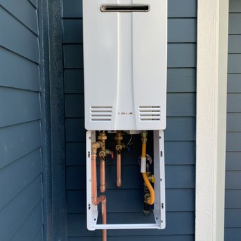 West Coast Hydronics and Plumbing - Outdoor tankless water heater, with pipe cover. - Water Heater Installation/Repair Near Me West Coast Hydronics and Plumbing - Outdoor tankless water heater, with pipe cover. - Water Heater Installation/Repair Near Me