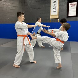 Shojin Kai Karate - Kids students practice breaking boards to develop their technique, power of focus and speed. They will gain confidence when acheiving.