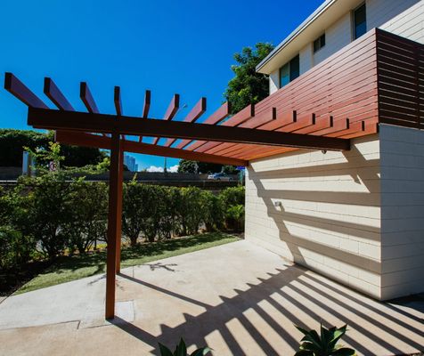 Photo of Defensible Designs - Orinda, CA, US. Sample of "Knotwood" aluminum product on a pergola