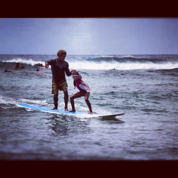 Buttons Surf School - My 8 year old surfing with Buttons.  She eventually rodes waves by herself. She loved it! - Surfing Near Me - Haleiwa, Hawaii