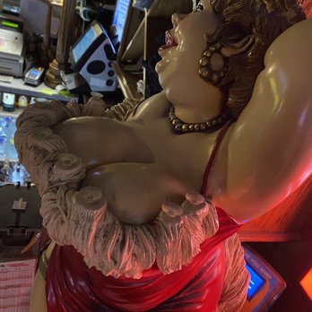 Kernville Saloon - a statue of a woman in a red dress - Bars Near Me - Kernville, California