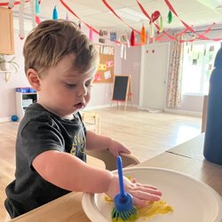 Little Acorns Grow - Finger painting in our beautiful Infant and Toddler Center.