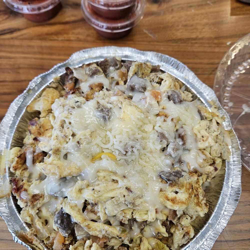 Brother's Burritos - Big Sky bowl with half brown rice half cauliflower, brisket, eggs, tomato and onion covered in cheese - Mexican Near Me - Hermosa Beach, California Brother's Burritos - Big Sky bowl with half brown rice half cauliflower, brisket, eggs, tomato and onion covered in cheese - Mexican Near Me - Hermosa Beach, California