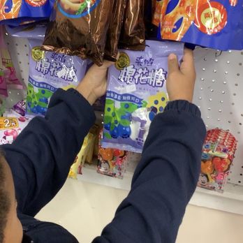 Dinosaur Asian Supermarket - a boy reaching for snacks - International Grocery Near Me - Jacksonville, Florida Dinosaur Asian Supermarket - a boy reaching for snacks - International Grocery Near Me - Jacksonville, Florida