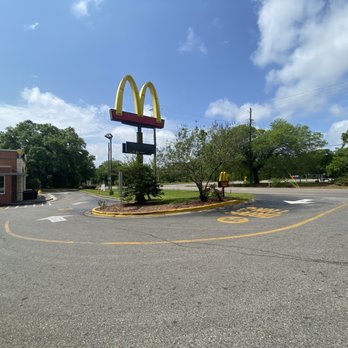 McDonald's - a mcdonald's sign in the middle of a parking lot - Burgers Near Me - Irvington, Alabama
