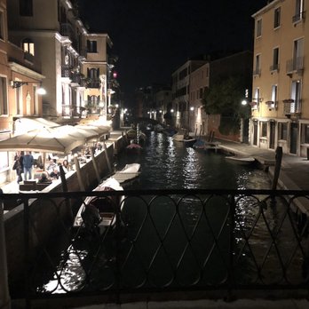 American-Dinesen - View from the bridge looking towards the hotel on the left just past umbrellas - Hotels Near Me - Venezia, VE