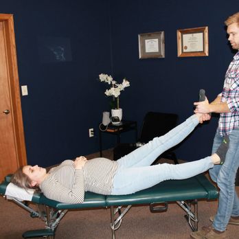 Dorr Chiropractic - Chiropractor Mike Dumond performs an ankle adjustment on a patient - Chiropractors Near Me - Dorr, Michigan Dorr Chiropractic - Chiropractor Mike Dumond performs an ankle adjustment on a patient - Chiropractors Near Me - Dorr, Michigan
