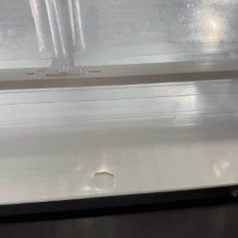 Resort Realty - hole in refrigerator - Property Management Near Me - Nags Head, North Carolina