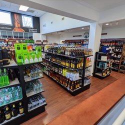 ABC Store - Inside. View of a good bit of the main floorspace. The boxes on the far wall can be used to transport bottles home.