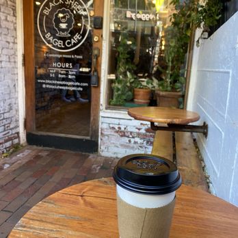 Black Sheep Bagel Cafe - Hot cafe con leche outside, cause it's crowded inside - Bagels Near Me - Cambridge, Massachusetts
