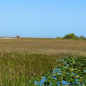 Airboat In Everglades - Another airboat whizzing by! - Boat Tours Near Me - Miami, Florida Airboat In Everglades - Another airboat whizzing by! - Boat Tours Near Me - Miami, Florida