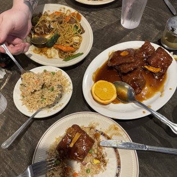 Hunan Village - Orange peel beef is on the bottom, beef lo main on top. - Chinese Near Me - Conroe, Texas