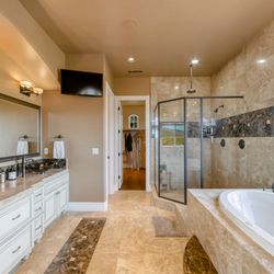 The Restoration House - A look into the primary bathroom with lovely lighting