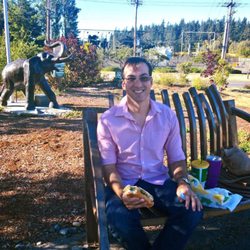 Freedom Park - The cool bench up the small hill we sat on and can see Mt Rainier through the round ring sculpture