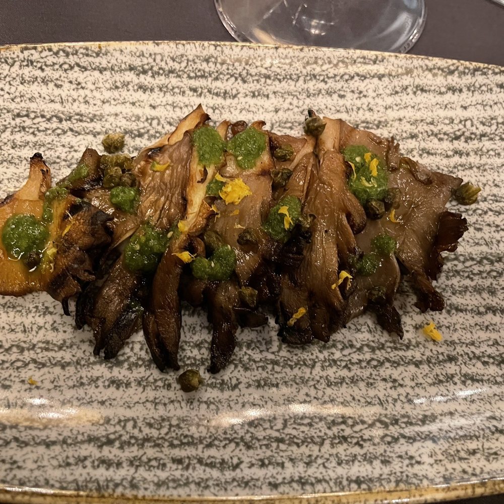 Nibi - Oyster mushrooms with Meyer lemon, capers, salsa verde - New American Near Me - Battle Creek, Michigan Nibi - Oyster mushrooms with Meyer lemon, capers, salsa verde - New American Near Me - Battle Creek, Michigan